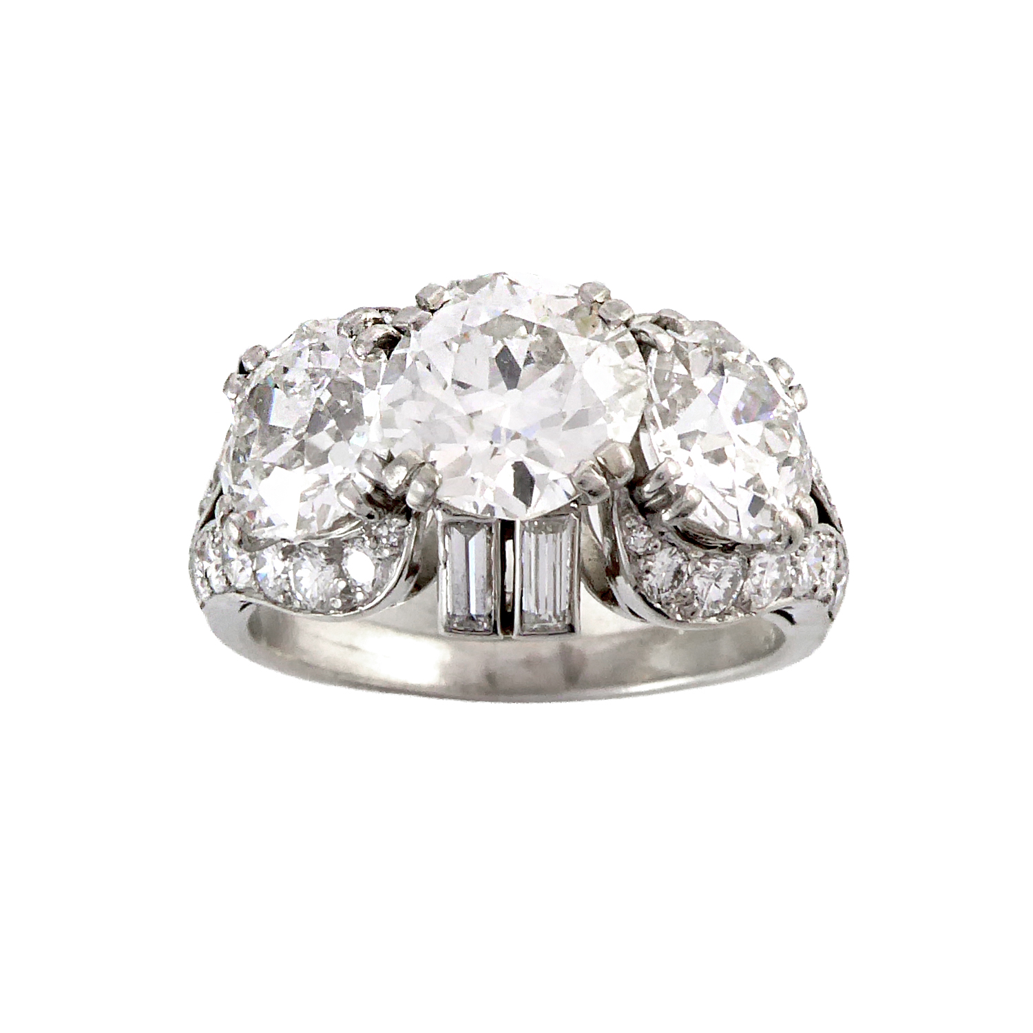 Three stone diamond cluster ring by Van Cleef & Arpels, Paris, the graduated old European cut diamonds in a raised mount,